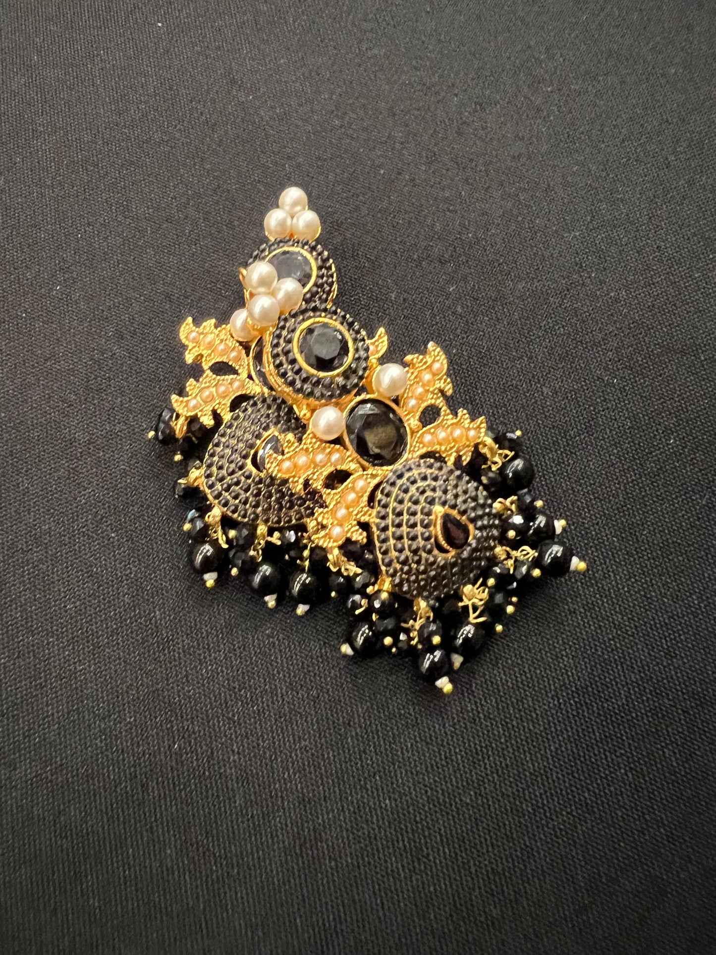Load image into Gallery viewer, Gold with black beaded earrings
